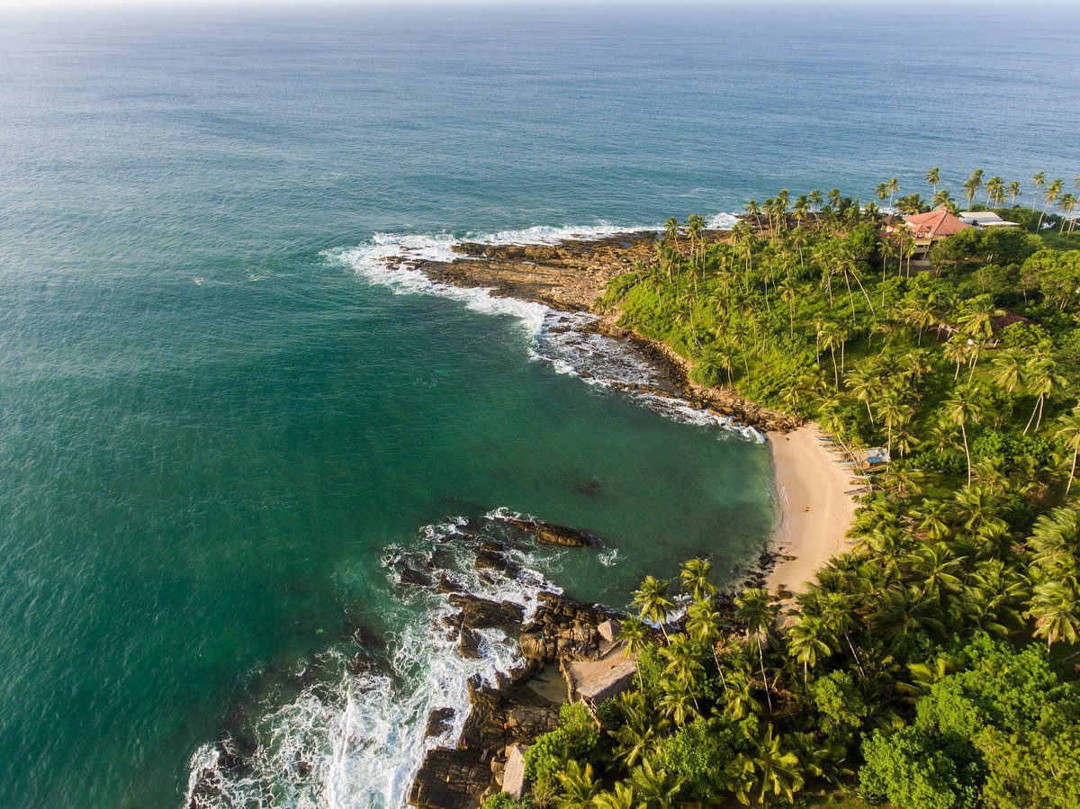 Arial view of mirissa beach Mirissa Beach – golden sands and turquoise waters in Sri Lanka.